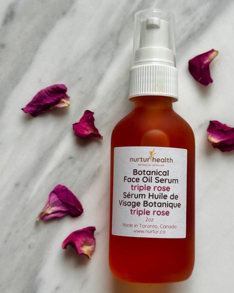 Dropper bottle of triple rose botanical face serum