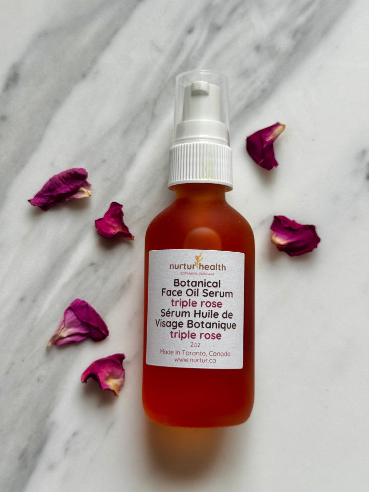 Dropper bottle of triple rose botanical face serum