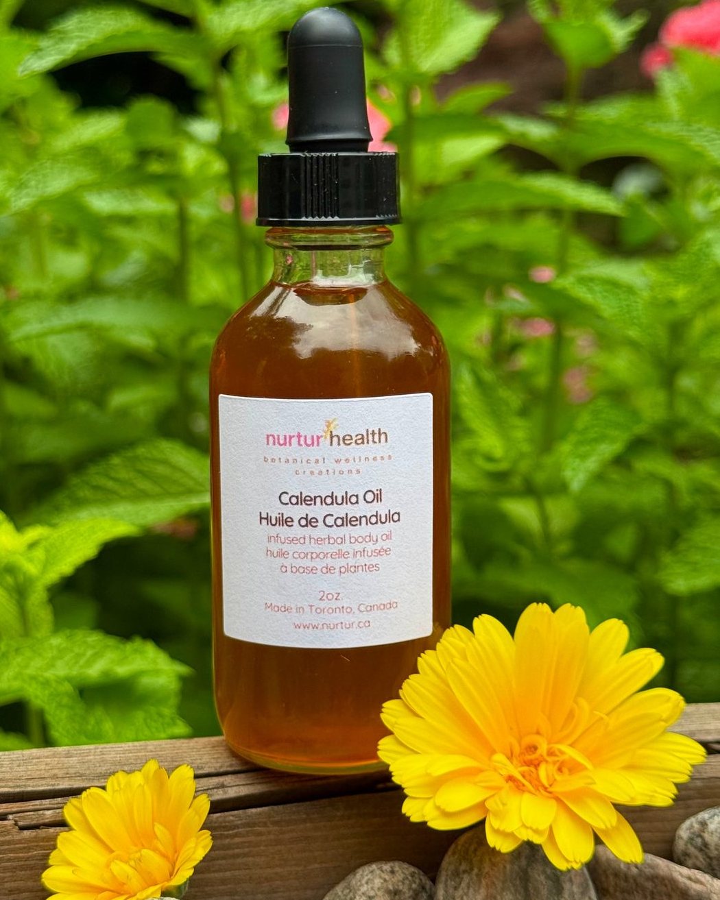 Bottle of calendula infused jojoba oil